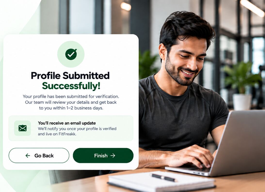 Profile Submitted Successfully confirmation next to a smiling trainer at his laptop